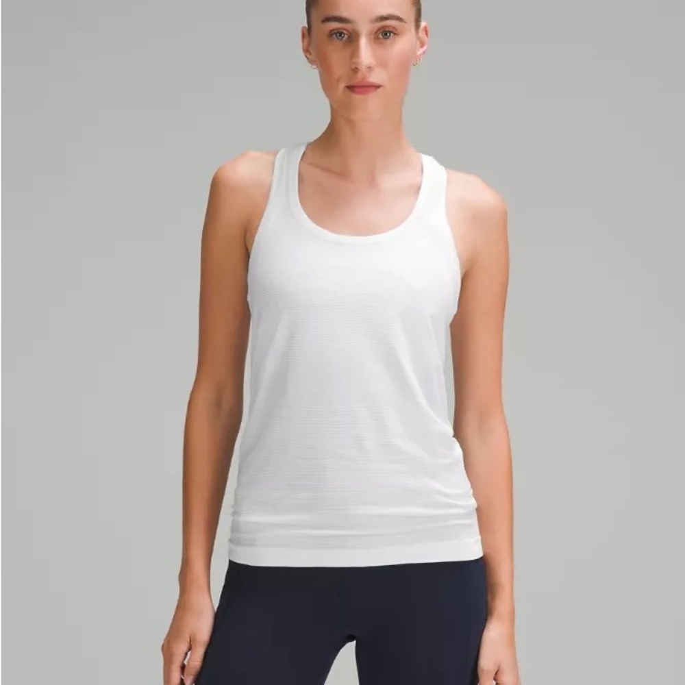 Lululemon Swiftly Tech Racerback Tank Top 2.0
Hip Length size 10 white